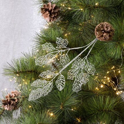 Gałązka dekoracyjna z ażurowymi listeczkami obsypanymi brokatem 60 x 20 cm srebrny