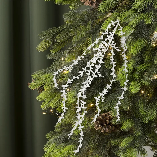 Zimowa gałązka dekoracyjna z delikatnych pnączy obsypana białym brokatem - długość 80 cm - biały