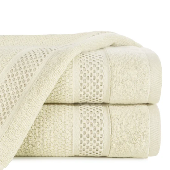 Ręcznik DANNY bawełniany o ryżowej strukturze podkreślony żakardową bordiurą o wypukłym wzorze - 30 x 50 cm - kremowy