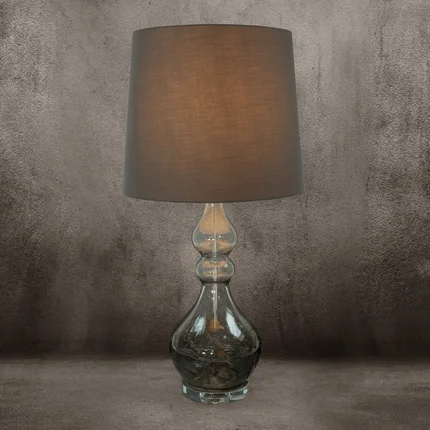 Lampa stołowa TIANA na podstawie ze szkła z abażurem z matowej tkaniny Lampa stołowa TIANA na podstawie ze szkła z abażurem z matowej tkaniny - 32 x 38 x 76 cm
