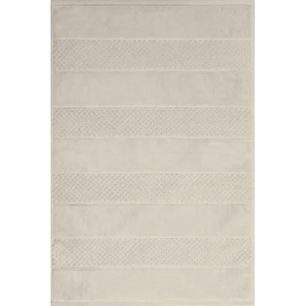 Dywanik łazienkowy JESSI z bawełny zdobiony geometrycznym wzorem Dywanik łazienkowy JESSI z bawełny zdobiony geometrycznym wzorem - 60 x 90 cm