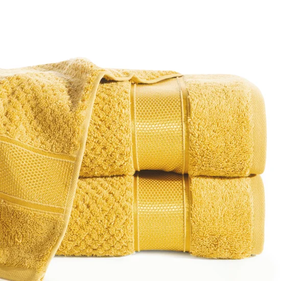 EUROFIRANY PREMIUM Ręcznik MILAN z puszystej bawełny frotte o ryżowej strukturze z błyszczącą bordiurą - 70 x 140 cm - musztardowy