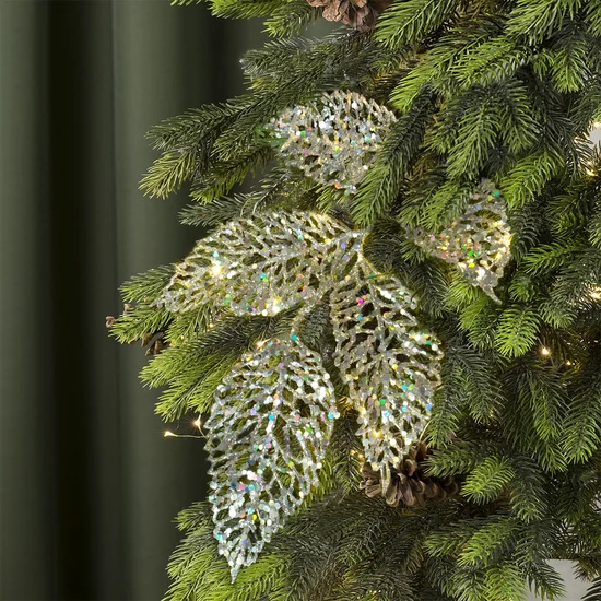 Zimowa gałązka z ażurowymi listkami obsypana srebrnym brokatem - 25 cm - srebrny